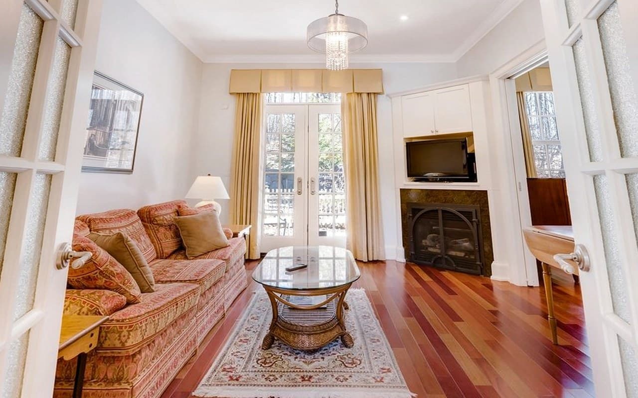 The same living room warped to show a camera tilted upward, with the door frames leaning inward toward the top.