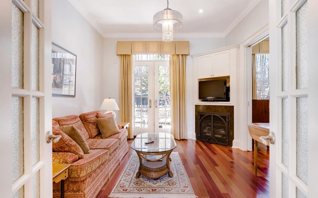 A living room, before and after Miravely restyles it. The walls and window stay exactly where they were.